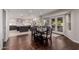 Open concept kitchen featuring stainless steel appliances, tile backsplash, and dark wood dining table at 9921 E Doubletree Ranch Rd, Scottsdale, AZ 85258