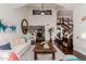 Bright living room featuring vaulted ceilings, wood floors, neutral walls and an accent mirror at 9921 E Doubletree Ranch Rd, Scottsdale, AZ 85258