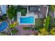 Aerial view of the backyard pool and landscaping with seating and desert landscape at 9921 E Doubletree Ranch Rd, Scottsdale, AZ 85258