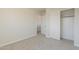 Neutral bedroom with carpeted floors, a closet, and white trim at 9939 W Southgate Ave, Tolleson, AZ 85353