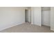 Neutral bedroom with carpeted floors, a closet, and white trim at 9939 W Southgate Ave, Tolleson, AZ 85353