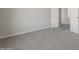 Neutral bedroom with carpeted floors, a closet, and white trim at 9939 W Southgate Ave, Tolleson, AZ 85353