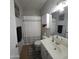 Traditional bathroom with a shower-tub combination, single sink vanity, and neutral color palette at 10036 W Chipman Rd, Tolleson, AZ 85353