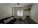 Cozy bedroom with futons, neutral walls, and a bright window, creating a relaxing atmosphere at 10036 W Chipman Rd, Tolleson, AZ 85353