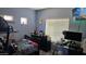 Comfortable bedroom with a Simpsons television, ample storage, and natural light, perfect for relaxing at 10036 W Chipman Rd, Tolleson, AZ 85353