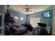 Cozy bedroom with a Simpsons television, ample storage, and natural light, perfect for relaxing at 10036 W Chipman Rd, Tolleson, AZ 85353