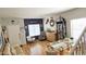 Comfortable living area with a glass dining set, modern decor, and plenty of natural light at 10036 W Chipman Rd, Tolleson, AZ 85353