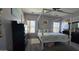 Bright main bedroom featuring a four-post bed, complemented by stylish decor and large windows at 10036 W Chipman Rd, Tolleson, AZ 85353
