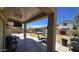 Covered patio offering a comfortable place for outdoor dining, entertainment, and relaxation in the backyard at 10036 W Chipman Rd, Tolleson, AZ 85353