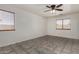 Spacious bedroom with tile floors and natural light from multiple windows at 10408 W Miami St, Tolleson, AZ 85353