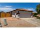 Charming single-story home with a well-manicured front yard and a spacious two-car garage at 10408 W Miami St, Tolleson, AZ 85353