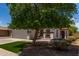 Charming single-story home with a well-manicured front yard and a spacious two-car garage at 10408 W Miami St, Tolleson, AZ 85353
