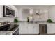 Well-lit kitchen with granite counters and stainless steel appliances at 10408 W Miami St, Tolleson, AZ 85353