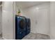 Laundry room with matching washer and dryer units and tile floors at 10408 W Miami St, Tolleson, AZ 85353