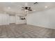 Open-concept living room with tile flooring and recessed lighting at 10408 W Miami St, Tolleson, AZ 85353