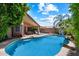 Spacious backyard features a sparkling pool, patio, and well-manicured landscaping at 11253 E Peterson Ave, Mesa, AZ 85212