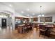 Spacious kitchen featuring stainless steel appliances and a granite countertop island with breakfast bar at 11253 E Peterson Ave, Mesa, AZ 85212