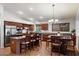 Spacious kitchen featuring stainless steel appliances and a granite countertop island with breakfast bar at 11253 E Peterson Ave, Mesa, AZ 85212