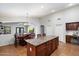 Open-concept kitchen with a granite countertop island, seamlessly connected to the dining area at 11253 E Peterson Ave, Mesa, AZ 85212