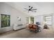 Bright bedroom with neutral tones, a ceiling fan, and ample seating at 11253 E Peterson Ave, Mesa, AZ 85212