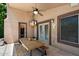 Covered patio with ceiling fan and table, ideal for outdoor dining and entertaining at 11253 E Peterson Ave, Mesa, AZ 85212