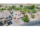 Aerial view of desert home with landscaped backyard including a water feature, pool, and two-car attached garage at 11965 W Monte Vista Rd, Avondale, AZ 85392