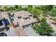 Aerial shot of property featuring a pool with rock waterfall, spacious layout, and a well-maintained yard at 11965 W Monte Vista Rd, Avondale, AZ 85392
