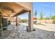 Spacious covered back patio with ceiling fans and view of a sparkling pool and backyard at 11965 W Monte Vista Rd, Avondale, AZ 85392