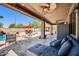 Relaxing covered patio with outdoor seating and view of the sparkling pool area at 11965 W Monte Vista Rd, Avondale, AZ 85392
