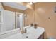Neutral bathroom with white vanity, large mirror, and a tiled shower at 11965 W Monte Vista Rd, Avondale, AZ 85392