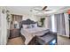Warm bedroom featuring a king bed, bedside tables, lamps, and seating at 11965 W Monte Vista Rd, Avondale, AZ 85392