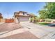 Charming two-story home with a well-manicured lawn, spacious driveway, and a two car garage at 11965 W Monte Vista Rd, Avondale, AZ 85392