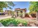 Inviting single Gathering home featuring lush landscaping and a tile roof in a desirable neighborhood at 11965 W Monte Vista Rd, Avondale, AZ 85392