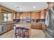 Stylish kitchen with custom cabinets, stainless steel appliances, and granite countertops at 11965 W Monte Vista Rd, Avondale, AZ 85392