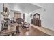 Living room featuring hardwood floors, neutral decor, and natural lighting at 11965 W Monte Vista Rd, Avondale, AZ 85392
