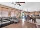 Open-concept living area features hardwood floors and sliding glass doors to the back yard at 11965 W Monte Vista Rd, Avondale, AZ 85392