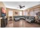 Comfortable living room featuring hardwood floors, natural lighting, and a ceiling fan at 11965 W Monte Vista Rd, Avondale, AZ 85392