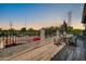 Inviting outdoor patio with seating and views of trees and the surrounding neighborhood at 11965 W Monte Vista Rd, Avondale, AZ 85392