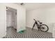 Spacious bonus room with patterned tile floor and ample space for various activities at 1209 W Colter St, Phoenix, AZ 85013