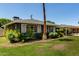 Picturesque front yard showcasing mature trees and a well-kept lawn at 1209 W Colter St, Phoenix, AZ 85013