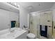 Well-lit bathroom featuring a shower, vanity, and mirror, ensuring a functional and tidy space at 12123 W Bell Rd # 211, Surprise, AZ 85378