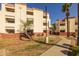 A multi-level condo building offers great access to sidewalks and mature landscaping at 12123 W Bell Rd # 211, Surprise, AZ 85378