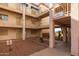 Multi-story condo complex featuring secure access and well-maintained grounds at 12123 W Bell Rd # 211, Surprise, AZ 85378
