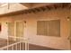 Exterior hallway with apartment doors and security screens, creating secure entrances at 12123 W Bell Rd # 211, Surprise, AZ 85378