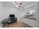 Open kitchen features counter seating, white cabinets, and decorative backsplash, creating an inviting culinary space at 12123 W Bell Rd # 211, Surprise, AZ 85378