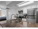 Updated kitchen with granite countertops, stainless steel appliances and access to the bedroom at 12123 W Bell Rd # 211, Surprise, AZ 85378