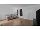 Spacious living room featuring tiled floors, a large window, and a comfortable couch at 12123 W Bell Rd # 211, Surprise, AZ 85378