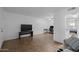 Bright living room with tiled floors, featuring views into the kitchen and bedroom at 12123 W Bell Rd # 211, Surprise, AZ 85378