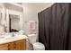 Bathroom featuring a vanity, toilet, shower with curtain and neutral color palette at 13324 W Annika Dr, Litchfield Park, AZ 85340