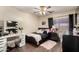 Bedroom featuring stylish décor, ceiling fan and wood-look flooring at 13324 W Annika Dr, Litchfield Park, AZ 85340